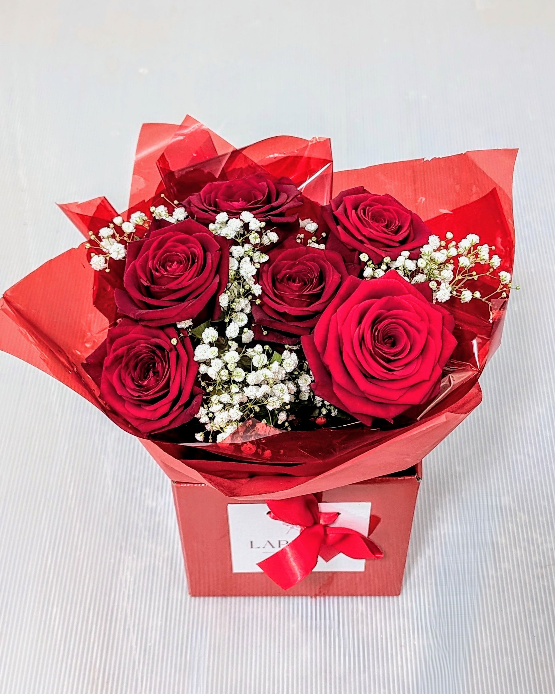 Petite flower box red roses and Gypsophila 