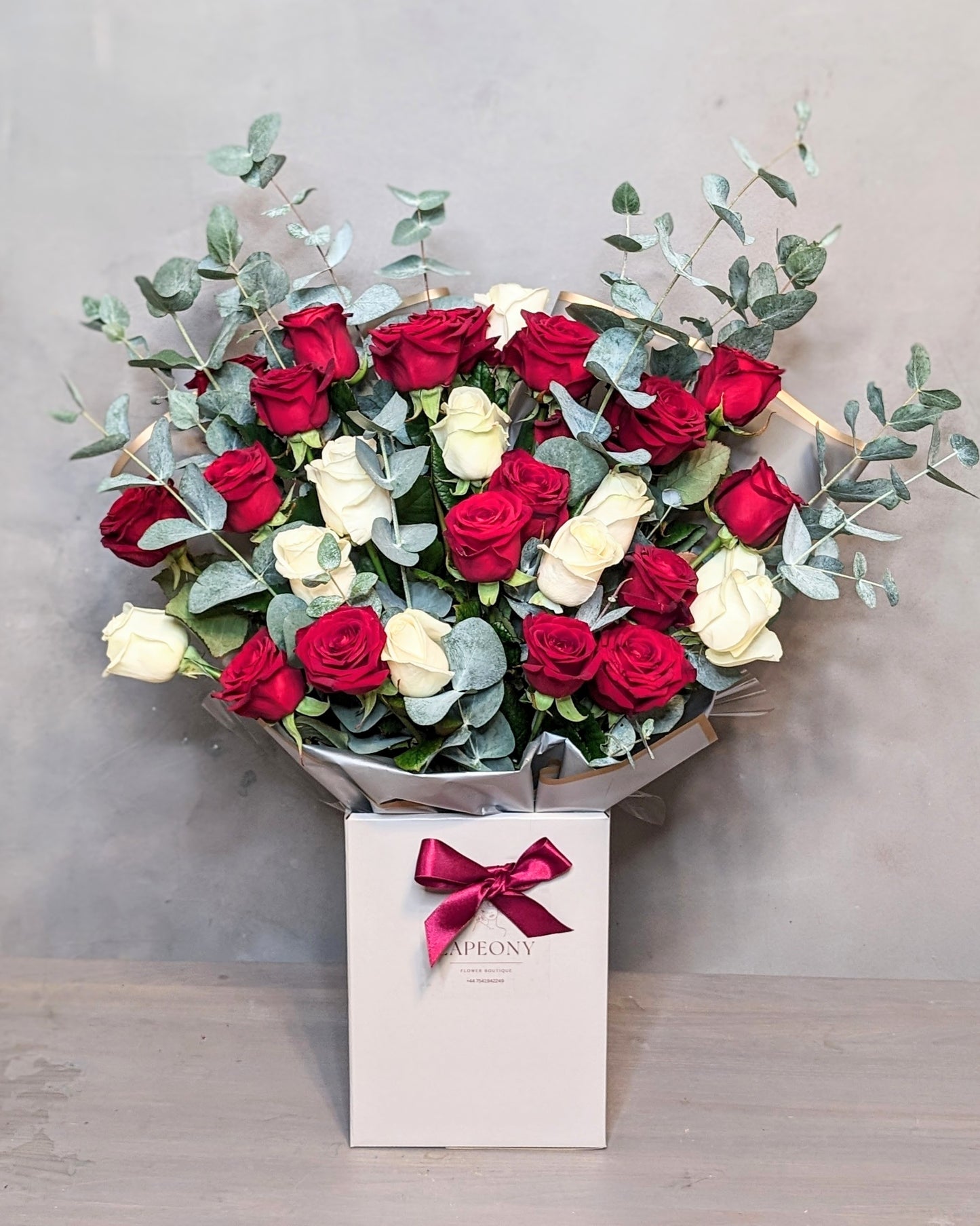 Crimson Flame: Premium Red and White Rose Face Fronting Bouquet