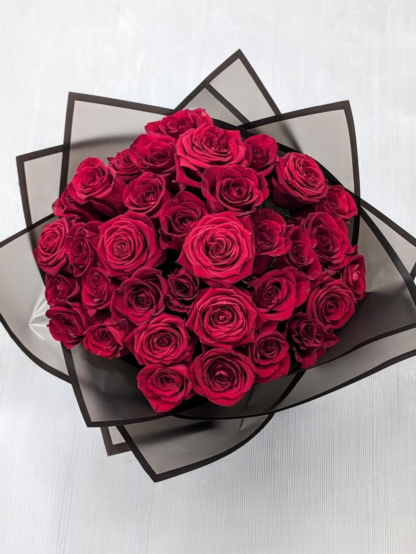 Premium Red Roses in Luxury Black Packaging